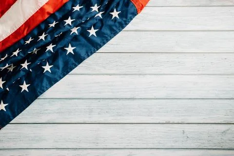 In honor of Veterans Day, American flags against a wooden backdrop Stock Photos