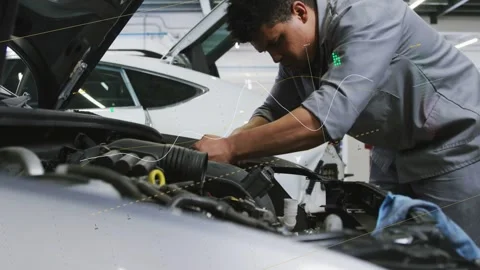 Hood opening, tech leaning into engine bay, reconnecting hoses while animated Video stock 333154416