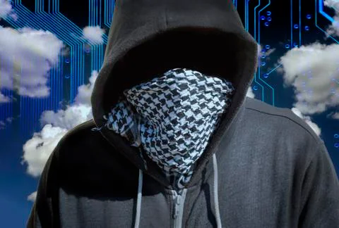 Hooded and masked computer hacker thief with a cloud computer based backgroun Stock Photos