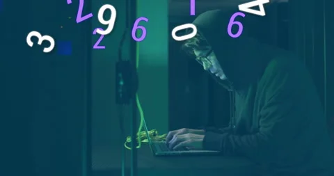 Hooded coder coding on laptop amid tech cables as purple numerals swirling Stock Footage 313509532