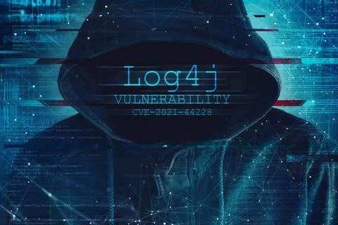Hooded computer hacker in cybersecurity vulnerability Log4J concept Stock Photos