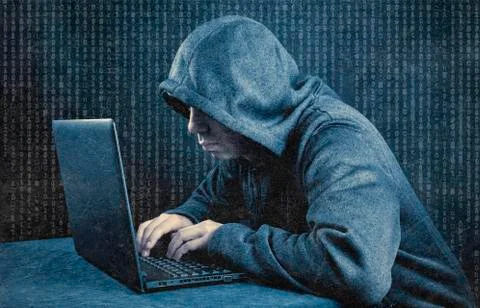 Hooded computer hacker with laptop Stock Photos