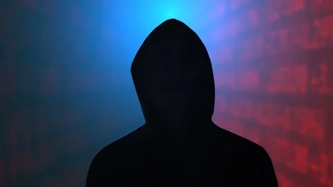 Hooded figure on a data background Stock Footage