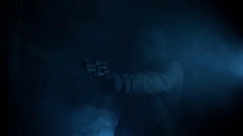 Hooded Gunman Aiming Weapon in Dark Fog, Crime and Danger Concept Stock Footage 332496497