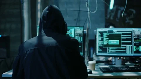 Hooded Hacker Breaks into Corporate Data Servers and Infects them with Virus.  Stock Footage 76074583