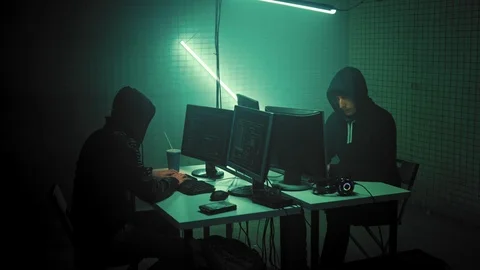 Hooded Hacker Breaks into Corporate Data Servers and Infects them with Virus Stock Footage 114508954