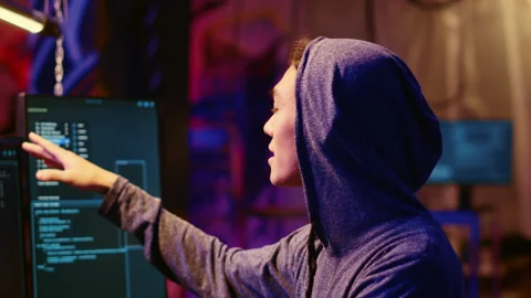 Hooded hacker coding malware Stock Footage 256112315
