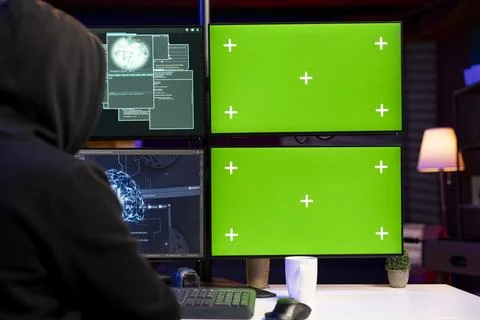 Hooded hacker installing spyware using isolated screen PC and AI Stock Photos
