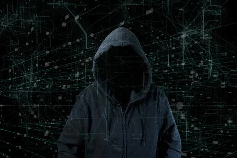 Hooded hacker man working on a code on dark digital background 写真素材