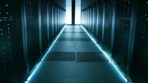 Hooded Hacker in a Mask Climbs From Under Floor Hatch in Data Center.  Stock Footage