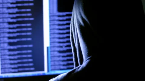 Hooded hacker spreading a virus to the website Stock Footage 72468419