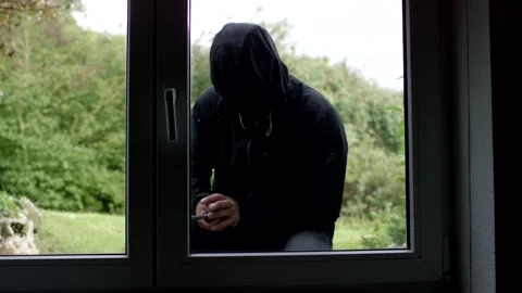 Hooded Intruder at Window Seen from Inside, Home Break In, Static Shot Vídeo Stock 341527533