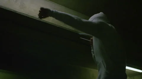 Hooded man doing boxing training in urban setting Stock Footage 47530953