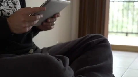 Hooded Man Using Tablet 库存影片 40320556