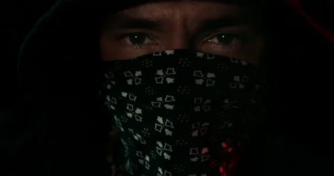 Hooded masked man staring into the camera. Stock Footage 136668602