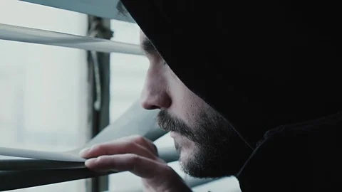 Hooded young man inside dark derelict ghetto building apartment Stock Footage 72558198