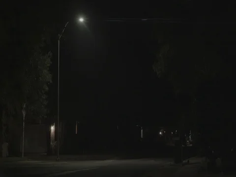 HoodedMan StreetlightNight EDITED Anamorphic Stock Footage 100802300