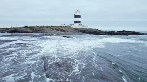 Hook Lighthouse Low Panning Drone Shot Over Ocean Vídeos de archivo 333353100