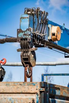 Hook of old rusty construction crane. Stock Photos