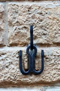Hook on stone wall Stock Photos