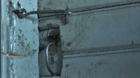 Hook unlocking an old rustic door and door opens Stock-Footage 55033276