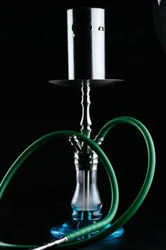 Hookah on a black background with smoke Stock Photos