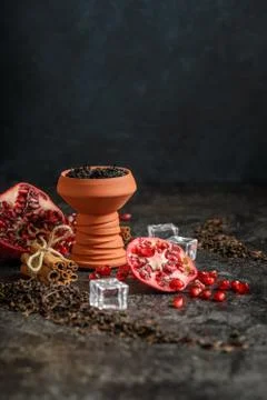 Hookah ceramic head fulled with aromated molose, pomegranade, blueberry and ice Stock Photos