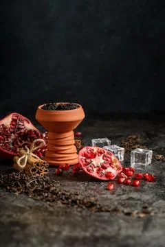 Hookah ceramic head fulled with aromated molose, pomegranade, blueberry and ice Stock Photos