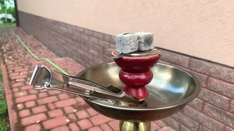 Hookah, cubes of smoldering coal in a hookah bowl. Smoking charcoal hookah Stock Footage 154823240