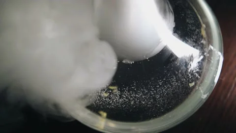 The hookah flask is on the table and it is enveloped in smoke Видео 158861610