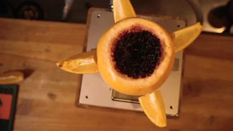 Hookah master makes a hookah from grapefruit. Fragrant Hookah 動画素材 134031364