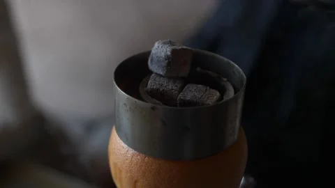 Hookah master is making a hookah from grapefruit. Fragrant Hookah Stock Footage 168516179