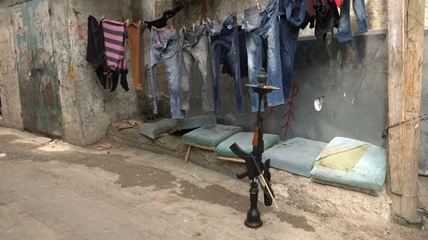 Hookah pipe resembling a rifle in permanent Palestinian refugee camp Stock-Footage 71523375