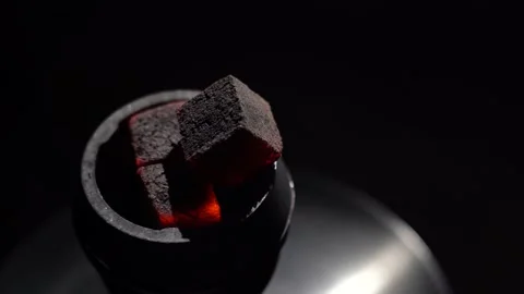 Hookah red hot coals, process hookah preparation. Blowing on hot hookah Stock Footage 149240845