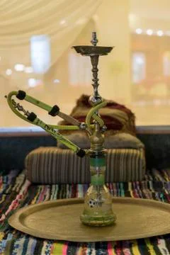 Hookah in the restaurant, hookah elements on the background of a blurry inter Stock Photos