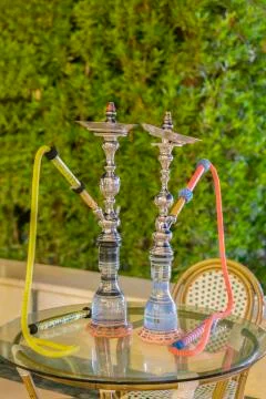Hookah in the restaurant, hookah elements on the background of a blurry inter Stock Photos