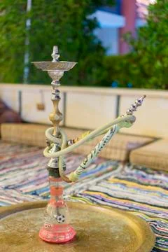 Hookah in the restaurant, hookah elements on the background of a blurry inter Stock Photos