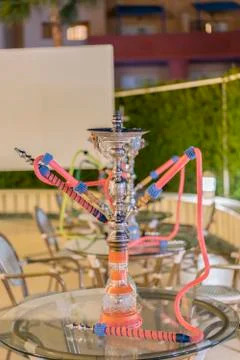 Hookah in the restaurant, hookah elements on the background of a blurry inter Stock Photos
