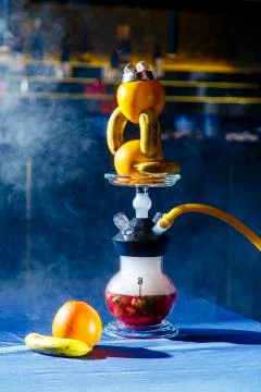 Hookah with a round transparent flask in which there is a red liquid. Hookah Stock Photos