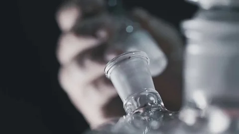 Hookah server prepares hookah for use Stock Footage 77345133