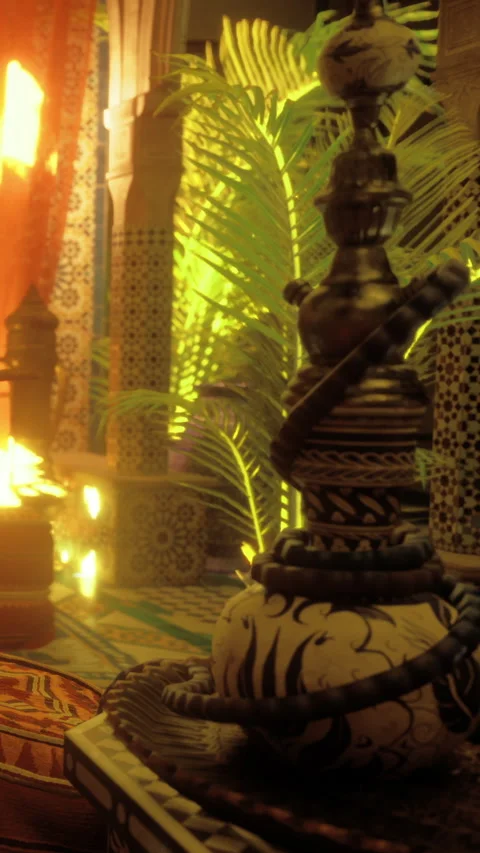 Hookah sits on a decorated table with bright colors in a warm space Stock Footage 331767418