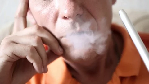 Hookah smoke come out of the man's mouth Stock Footage 99850375