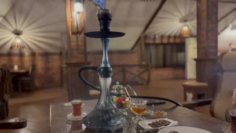 Hookah on a Tea Table at a Cafe Stock Footage 297730786