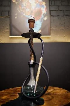 Hookan in front of the wall in bar Stock Photos