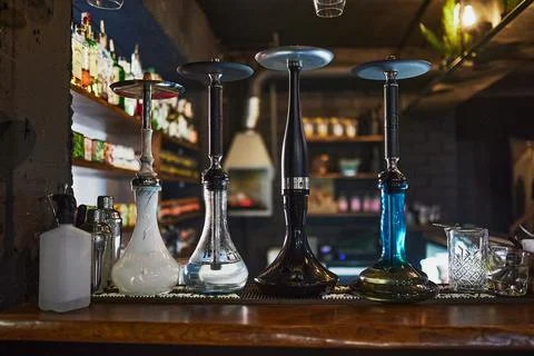 Hookans in front of the wall in bar Stock Photos