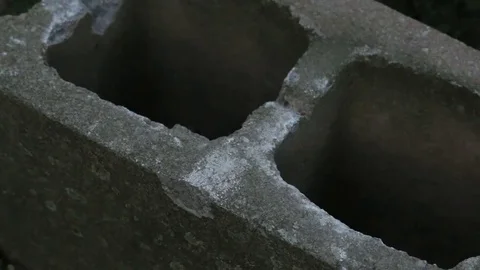 Hooked Copper Pipe on a Cinderblock Stock Footage 69143354