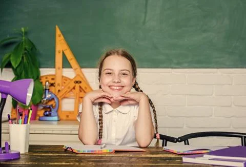 Hooked on learning. Small kid study school. Knowledge day. Accelerating into Stock Photos