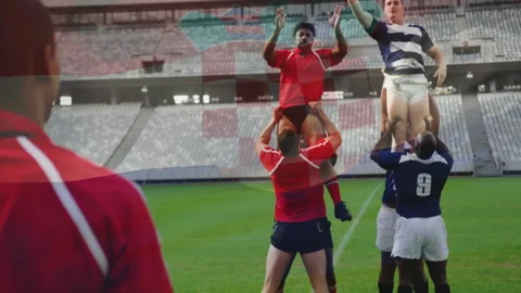 Hooker throwing ball in rugby lineout, lifters raising jumpers as striped jumper Stock Footage 311083720