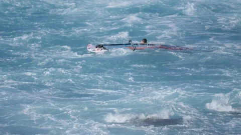 Hookipa Surf Windsurf Pro ripping waves 4k 60p slo-mo Stock Footage 109397432