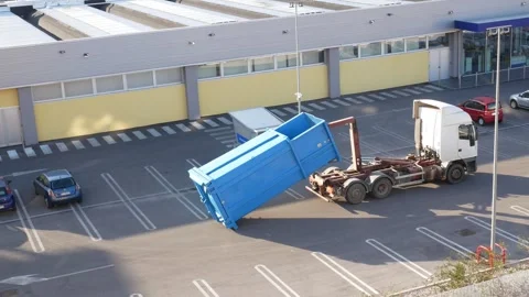 Hooklift truck loading a skip/container Stock-Footage 252996483